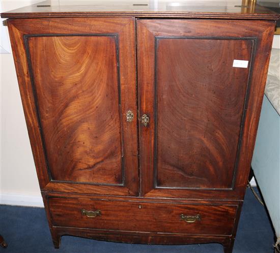 An early 19th century mahogany two door cupboard, W.94cm